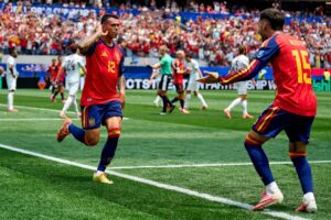 Pedro Porro celebrating after scoring for Spain