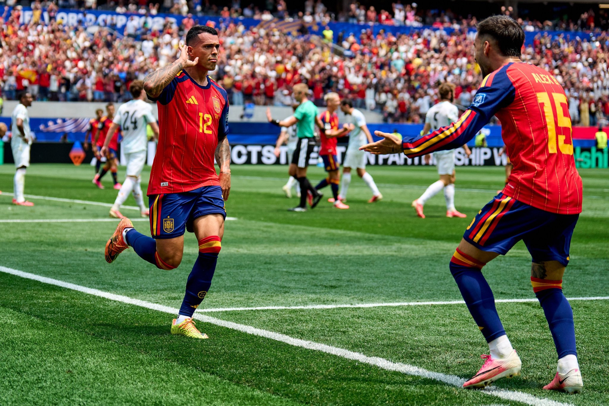 Pedro Porro celebrating after scoring for Spain