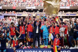 Spain coach lifting World Cup with players