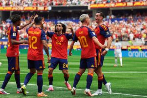 Spain team celebrating a goal on the pitch