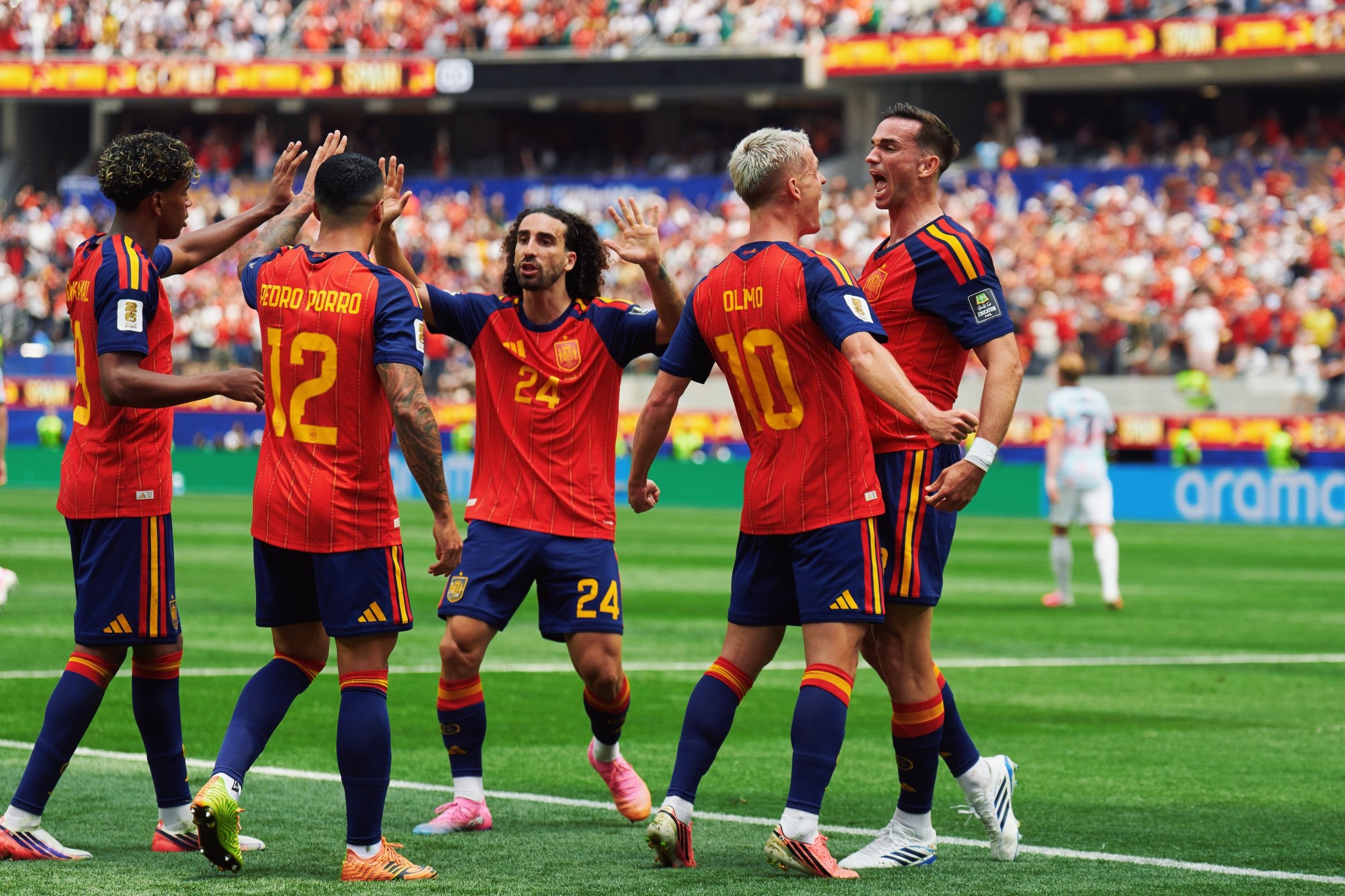 Spain team celebrating a goal on the pitch