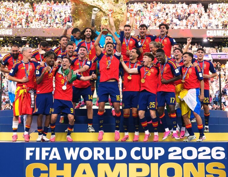 Spain players celebrating as captain Rodri lifts World Cup trophy