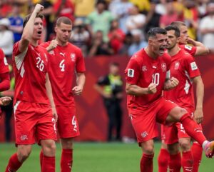 Switzerland players celebrating shootout win over Colombia