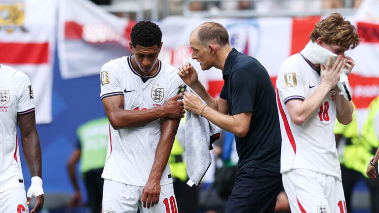 England coach Thomas Tuchel in conversation with Jude Bellingham