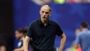 Thomas Tuchel walking on the pitch after England's defeat to Argentina