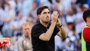 Liverpool boss Andoni Iraola applauding fans