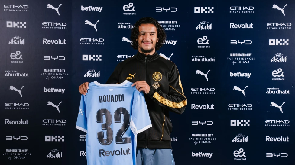 Ayyoub Bouaddi posing with a Manchester City jersey