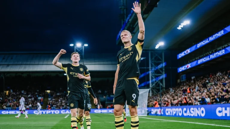 Erling Haaland and Elliot Anderson celebrating a Manchester City goal