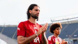 Dominik Szoboszlai applauding fans after a preseason game