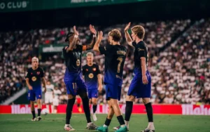 Rapinha, Fermin Lopez and Barcelona teammates celebrating a goal