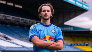 James Trafford posing in Leeds United shirt after joining from Manchester City