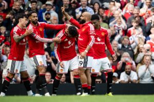 Manchester United squad celebrating a goal