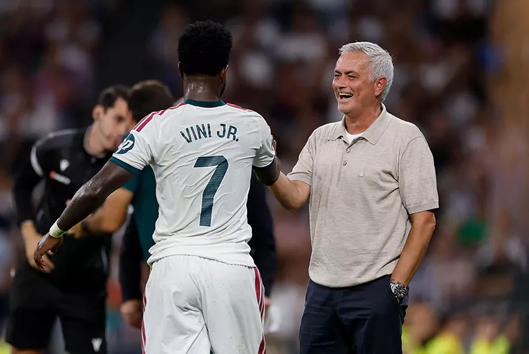 Vinicius Junior celebrating with Jose Mourinho
