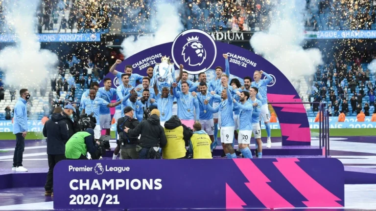 Manchester City lifting the Premier League trophy