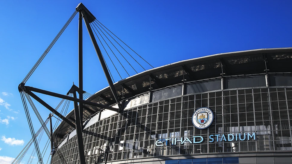 Manchester City's Etihad stadium with logo in view
