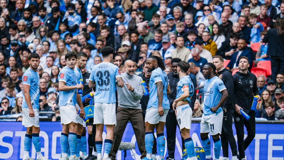 Pep Guardiola giving instructions to Manchester City players