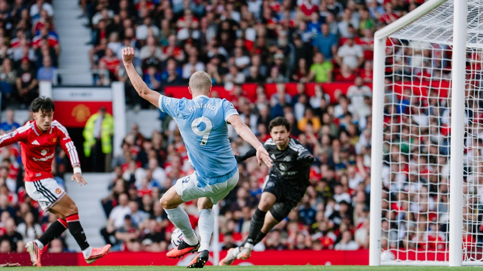 Erling Haaland scoring goal for Manchester City in the Manchester derby
