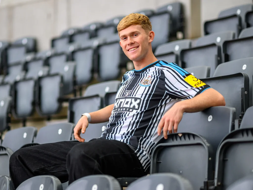 Lewis Hall sitting in the stands at St James' Park