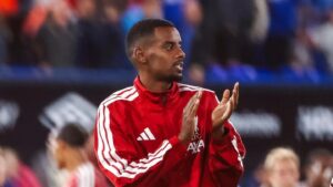 Alexander Isak applauding Liverpool fans