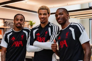 Liverpool players Bradley Barcola, Hugo Ekitike and Jeremy Jacquet posing