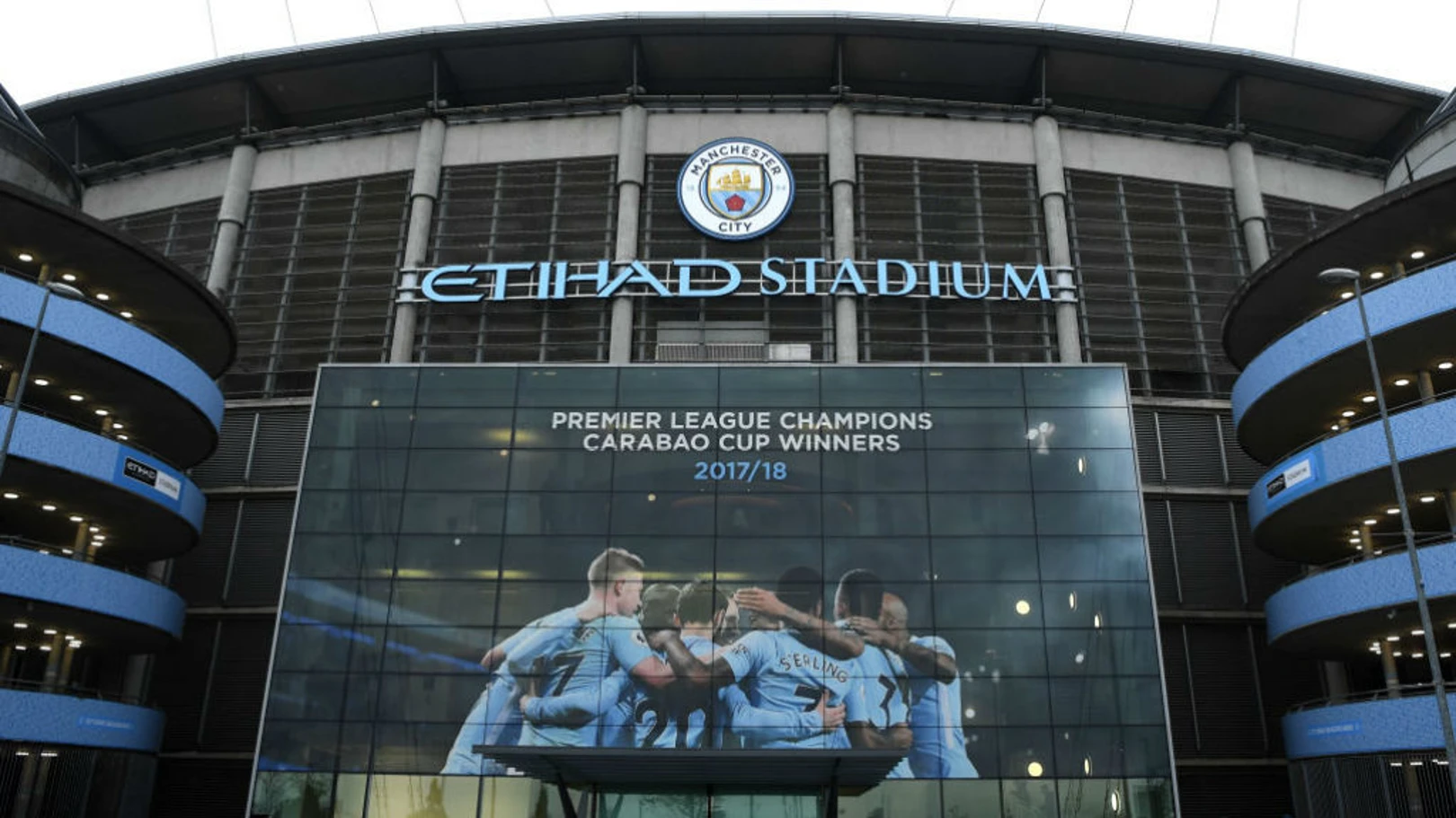 Manchester City Etihad Stadium with banner of players in front