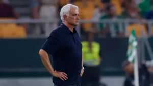 Jose Mourino watching Real Madrid game from the sidelines