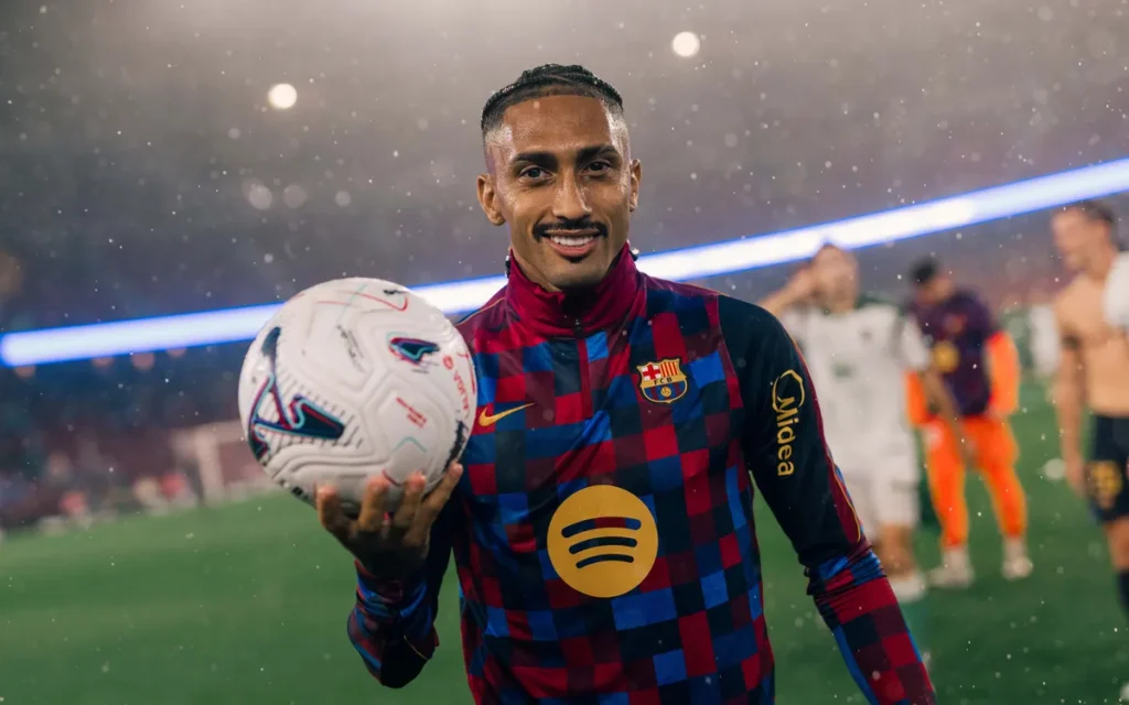 Raphinha holding a ball