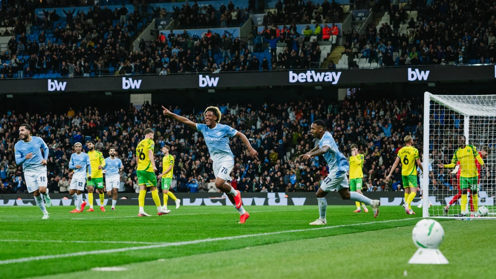Floyd Samba celebrating a goal for Manchester City