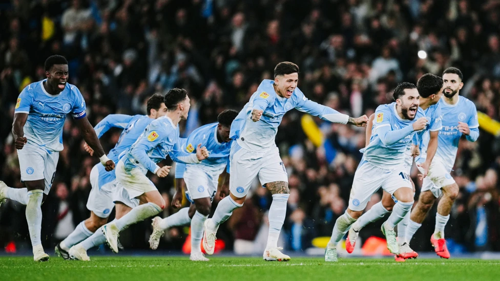 Manchester City players celebrating penalty win