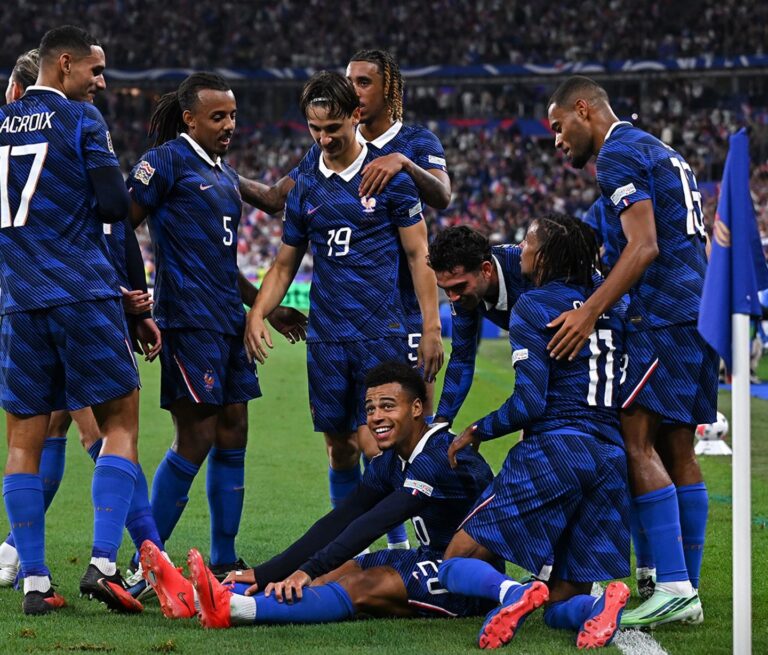 Desire Doue and Michael Olise celebrating France victory