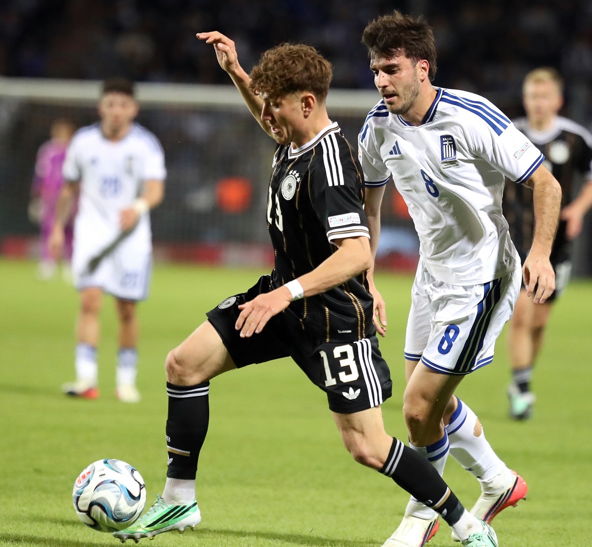 Germany and Greece players in action