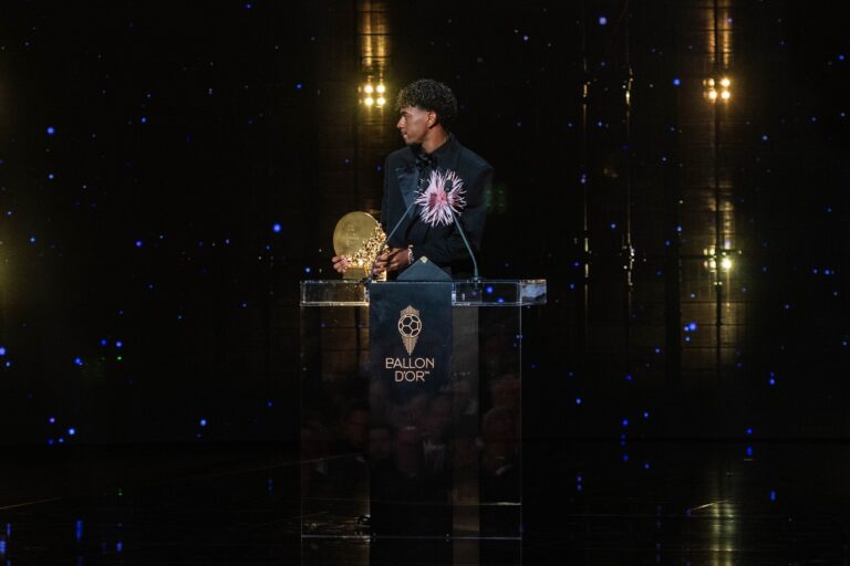 Lamine Yamal standing on the Ballon d'Or podium
